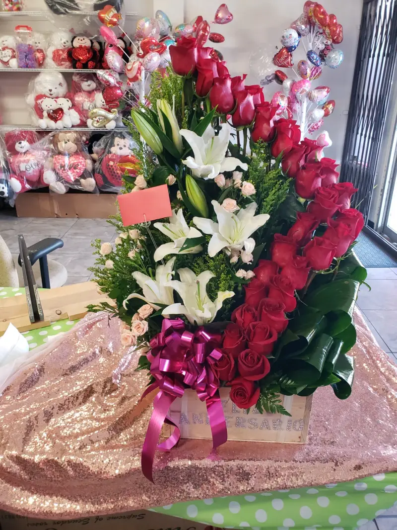 Anniversary arrangement of red roses and white lilies