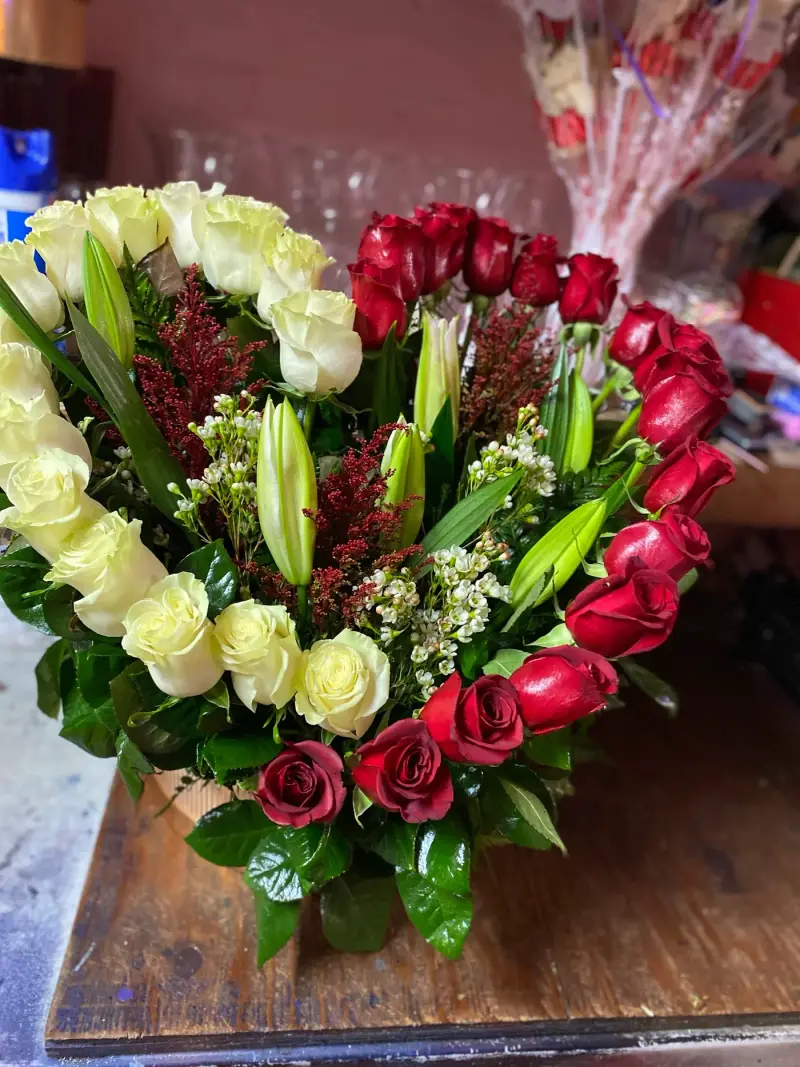 Heart of white and red roses with lilies by Rubidoux Flower & Gift Shop